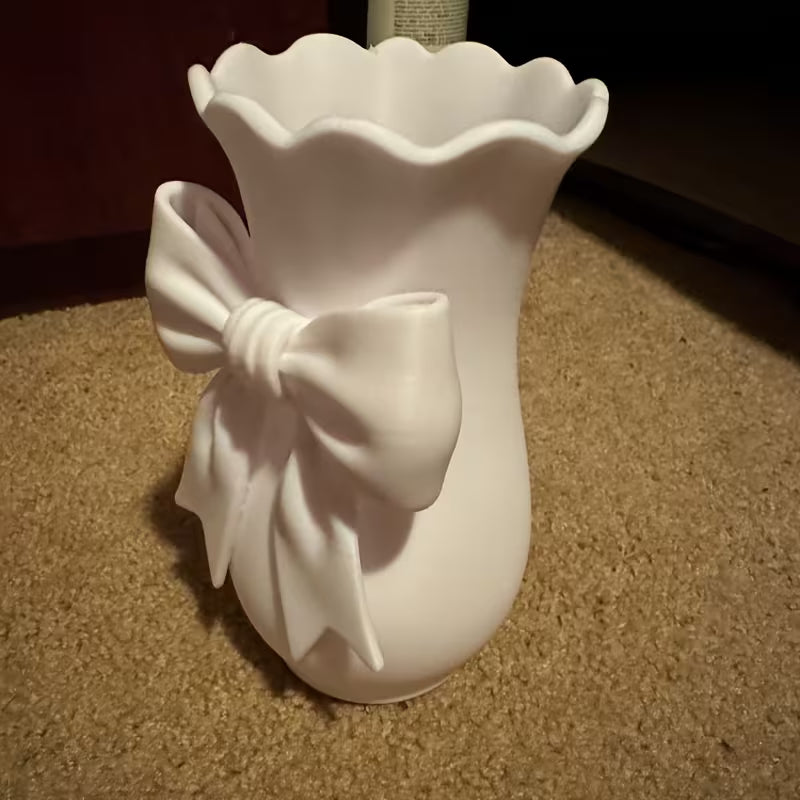 Decorative White Plastic Vase with Sculpted Bow Detail